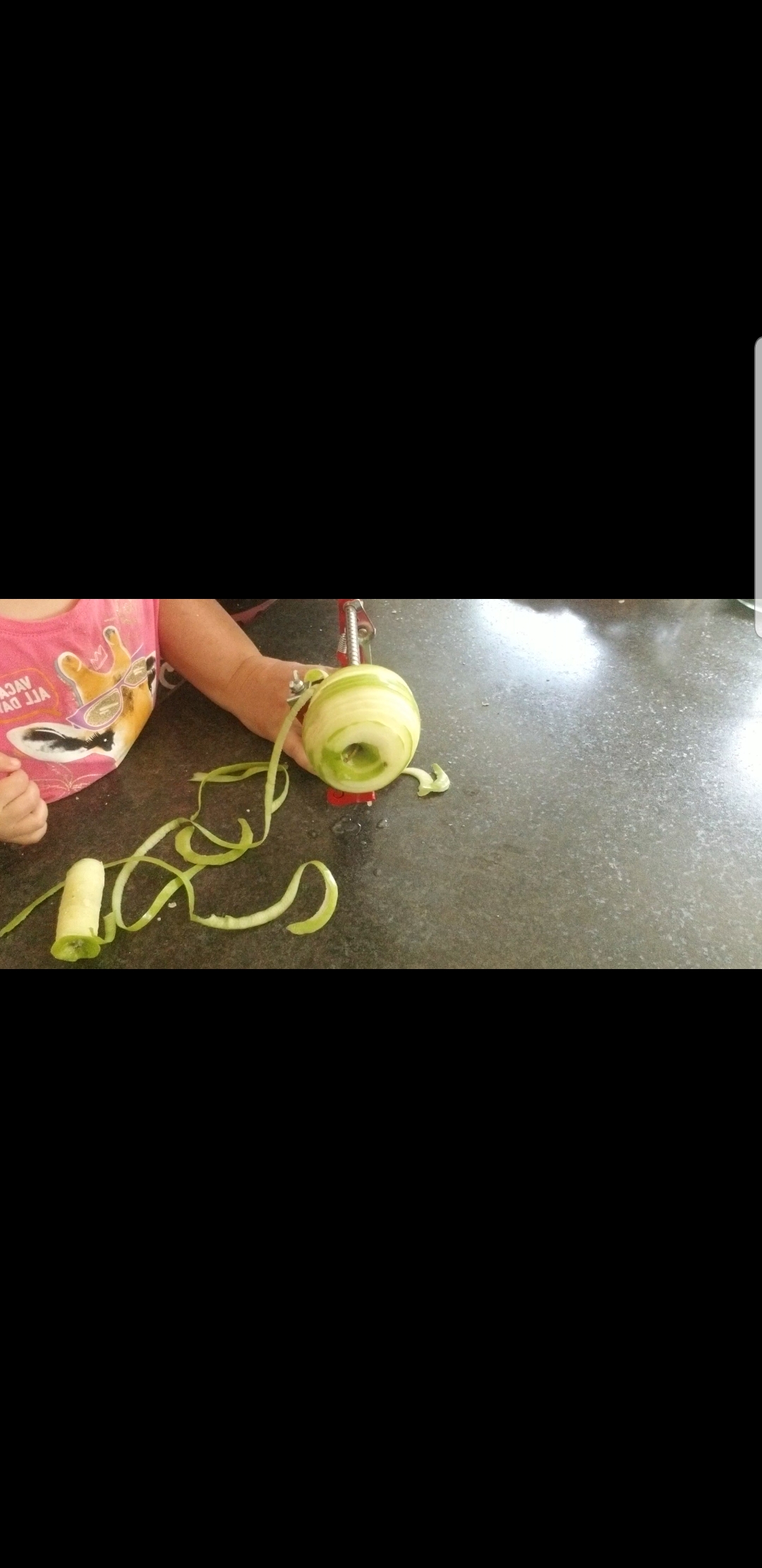 Apples being peeled with apple peeler